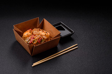 Glass noodles with shrimps and seafood, vegetables, spices and soy sauce