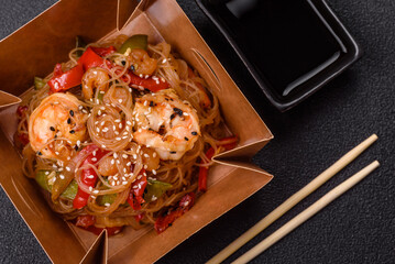 Glass noodles with shrimps and seafood, vegetables, spices and soy sauce