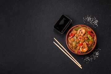 Glass noodles with shrimps and seafood, vegetables, spices and soy sauce