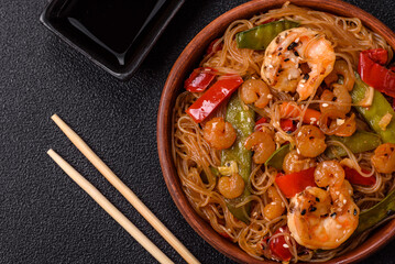 Glass noodles with shrimps and seafood, vegetables, spices and soy sauce