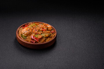 Glass noodles with shrimps and seafood, vegetables, spices and soy sauce