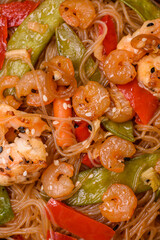 Glass noodles with shrimps and seafood, vegetables, spices and soy sauce