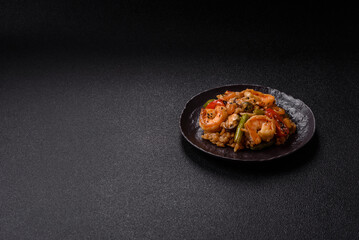 Rice with shrimps and seafood, vegetables, spices and soy sauce