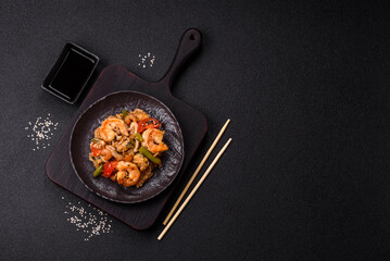 Rice with shrimps and seafood, vegetables, spices and soy sauce