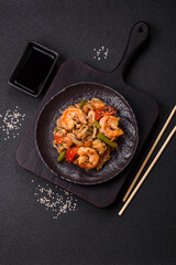 Rice with shrimps and seafood, vegetables, spices and soy sauce