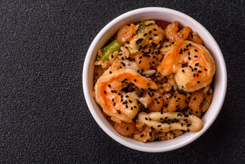 Rice with shrimps and seafood, vegetables, spices and soy sauce