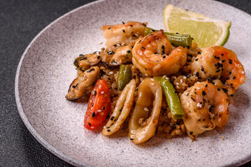 Rice with shrimps and seafood, vegetables, spices and soy sauce