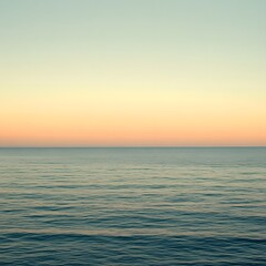Obraz premium Serene Ocean Sunset: Calm Sea and Pastel Sky