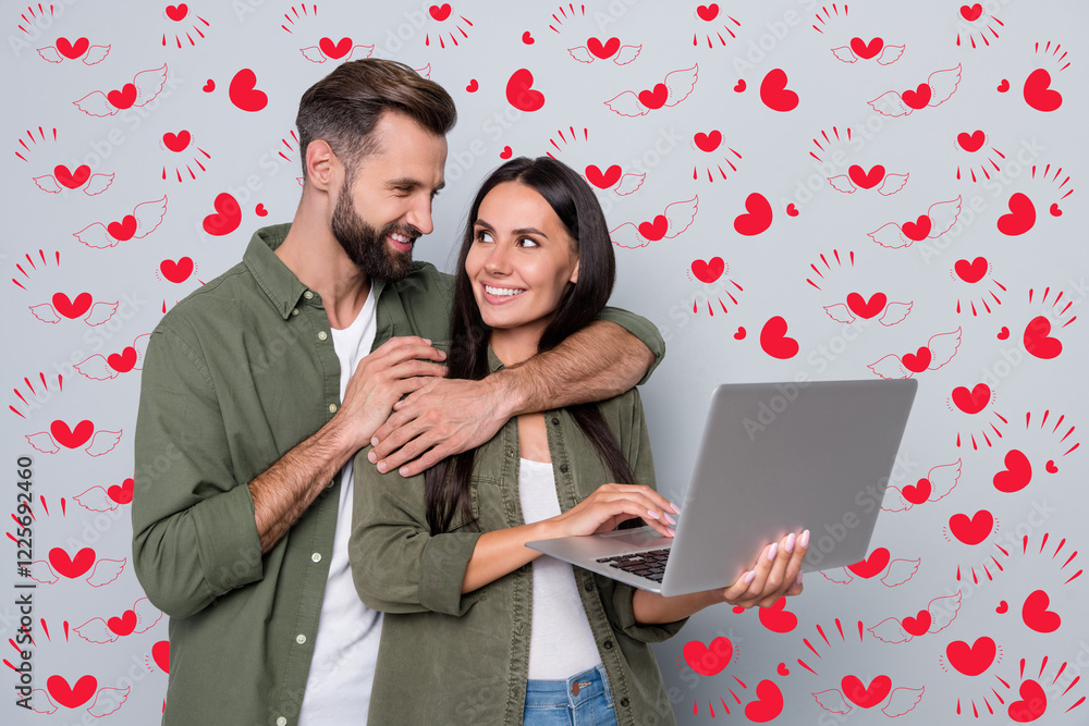 Poster portrait of attractive tender cheerful couple cuddling using laptop searching web isolated over grey