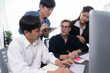 Group of diverse office worker employee working together on strategic business marketing planning in corporate office room. Positive teamwork in business workplace concept. Prudent