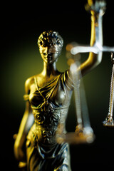 Lady Justice figure holding scales with yellow background