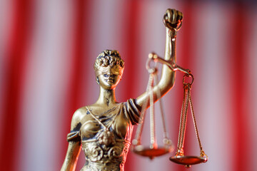 Lady Justice in front of American flag
