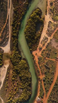 Aerial view of little lagoon surrounded by winding river and lush greenery, francois peron national park, western australia, australia.