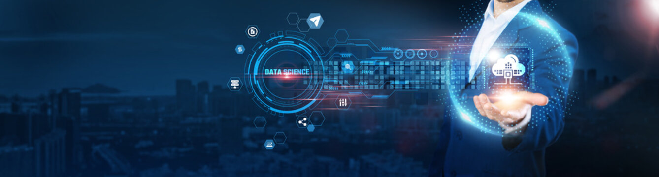 Data Science: Businessman holding analytics icon and data exchanges representing intelligent connection on city background, machine learning, big data, predictive modeling, and artificial intelligence