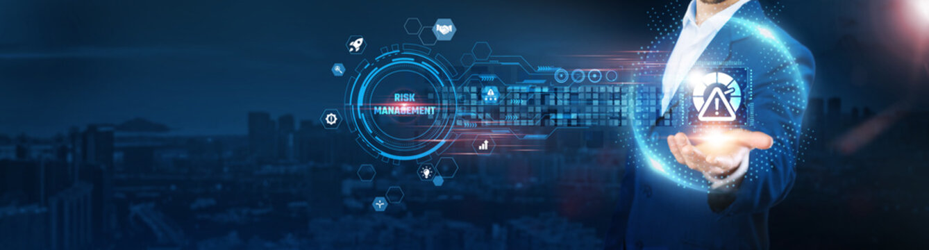 Risk Management: Businessman holding caution icon and data exchanges ensuring secure connection on city background, threat analysis, mitigation strategies, compliance monitoring.