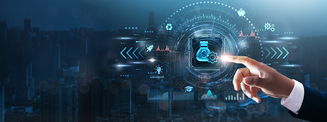 Budget: Businessman’s hand touching futuristic technological interface, financial planning, cost...
