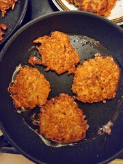 potato pancakes in a frying pan, crispy and tasty