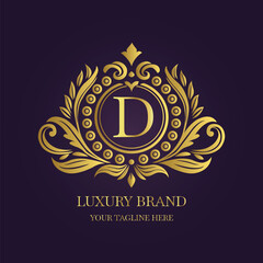 Gold Letter 'D' Logo with Ornamental Patterns and Floral Motifs on Purple  
