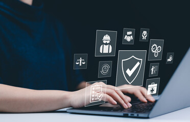 Work safety and compliance concept. A person using a laptop with digital icons representing work safety, compliance, regulations, and professional standards, symbolizing secure workplace practices.