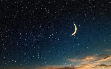 Naklejka premium Ramadan background with crescent, stars and glowing clouds with ray from skies. Month of Ramadan is that in which was revealed Quran. 