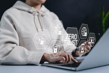 Zero trust security concept. A woman using a laptop with a digital interface Zero Trust security icons, symbolizing cybersecurity, data protection, and access control strategies. Secure network access