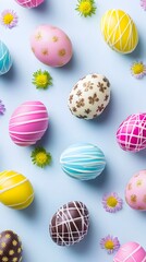 Obraz premium Collection of colorful Easter eggs adorned with chocolate glaze, sugar patterns, daisies flowers and festive decorations on bright white backdrop. Seasonal joy and celebration vertical background