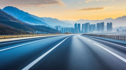 Fototapeta premium Asphalt highway road and mountain with skyline scenery at sunrise