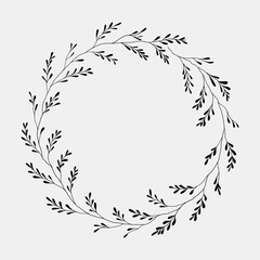 Large, intricate wreath with dense foliage in a minimalistic black and white style.