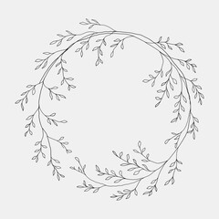 Bold botanical wreath with darker leafy elements, creating contrast in a minimal black and white style.