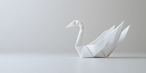 An elegant origami swan, meticulously folded from white paper, stands poised on a minimalist white background.  Its graceful form reflects the art of paper folding.