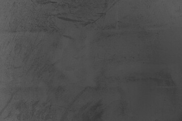 Abstract gray surface with subtle texture and dark tones creating depth