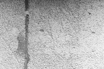 Concrete wall texture showing natural irregularities and surface details
