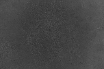 Surface with dark texture showcasing intricate details under soft light