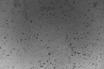 Textured concrete surface with speckles and variations in gray tones