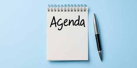Agenda written on a sticky note placed beside a pen, symbolising planning, organisation, and productivity