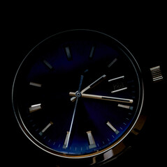 citizen mechanical watch lies on a black background
