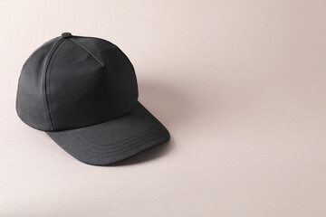 Stylish black baseball cap on light grey background. Mockup for design