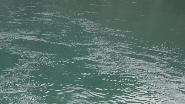 Calm flow of water in the river close up