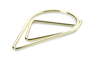 One golden paper clip isolated on white
