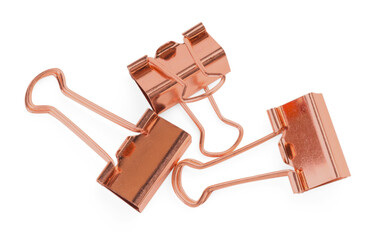 Golden binder clips isolated on white, top view