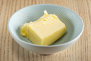 A pat of Irish butter in a small ceramic bowl.