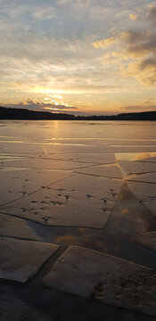 Sunset over the frozen lake