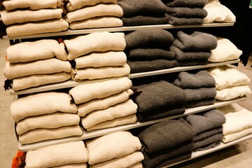 Neatly Folded, Soft and Trendy Sweaters Displayed on WellOrganized, Attractive Shelves