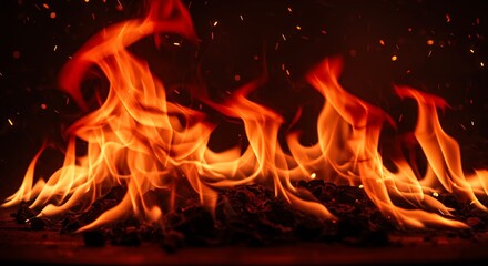 Fototapeta premium Fiery Embers and Flames Burning Brightly at Night