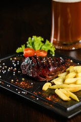 Grilled Steak with French Fries and Beer