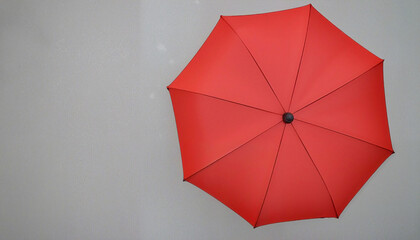 Red umbrella against gray background