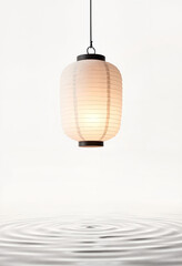 Obraz premium Glowing paper lantern over rippling water