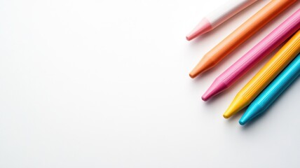 Obraz premium Colorful crayons on white background, art and creativity tools