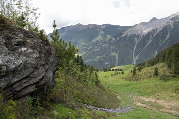 Scenic Alpine Valley with Rugged Rock Formation and Rolling Meadows in Zillertal, Tirol, Austria