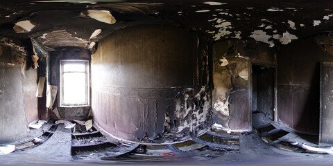 360 Degree panoramic sphere photo taken of an extremely run down property that has had a massive fire showing the burnt walls ceiling floors in the bedroom in the fire damaged house